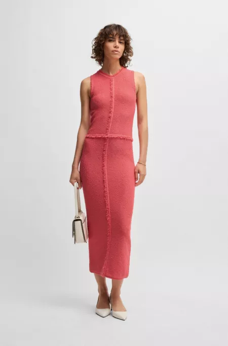 Sleeveless knitted dress with fringe trims