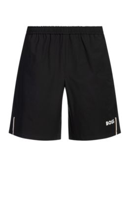 Shorts de tenis activos en tejido superel&aacute;stico de secado r&aacute;pido, Negro