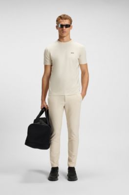 Pantalones slim fit de tejido el&aacute;stico hidr&oacute;fugo, Blanco