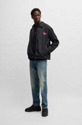 Veste d&rsquo;entra&icirc;neur Regular d&eacute;perlante &agrave; logos imprim&eacute;s, Noir