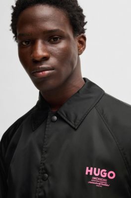 Veste d&rsquo;entra&icirc;neur Regular d&eacute;perlante &agrave; logos imprim&eacute;s, Noir