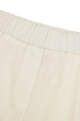 Relaxed-fit trousers in wool, White