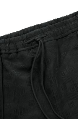 Relaxed-fit shorts with geometric logos, Black