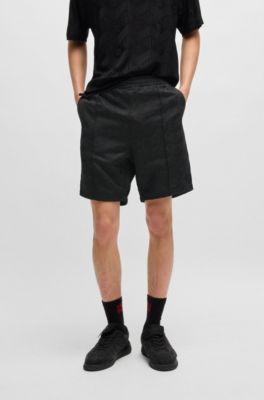 Relaxed-fit shorts with geometric logos, Black
