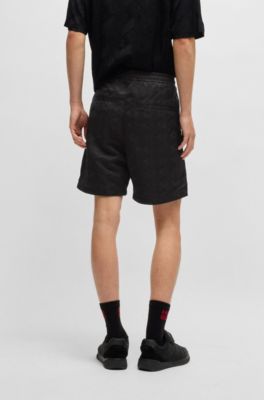 Relaxed-fit shorts with geometric logos, Black