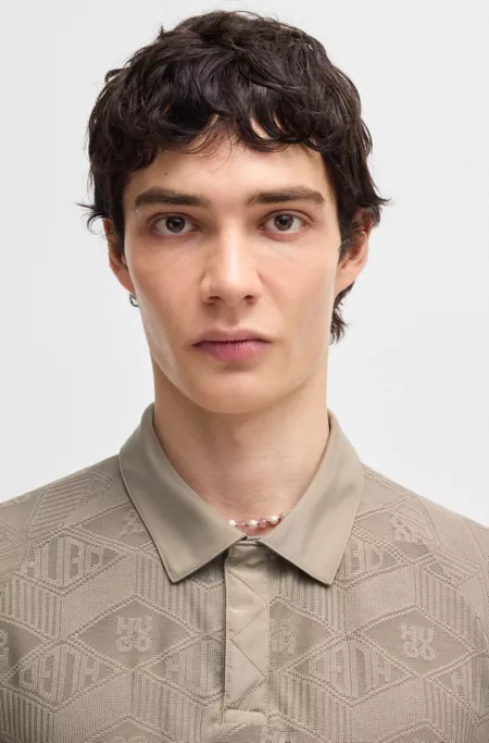 Logo-pattern polo shirt with contrast placket