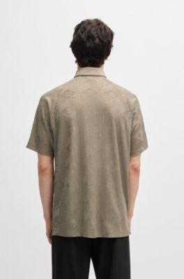 Polo &agrave; motif logot&eacute; avec patte de boutonnage contrastante, Marron