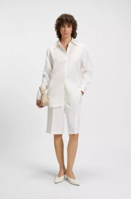 Tailored blouse with crochet-effect trims