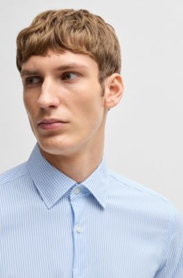 Camisa slim fit de tejido el&aacute;stico t&eacute;cnico a rayas, Celeste