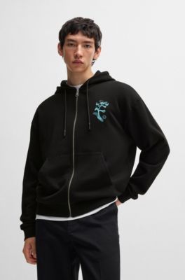 Sweat &agrave; capuche zipp&eacute; en molleton de coton avec motif artistique de la saison, Noir