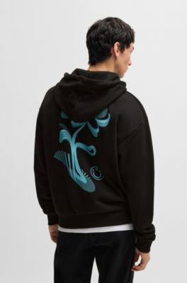 Sweat &agrave; capuche zipp&eacute; en molleton de coton avec motif artistique de la saison, Noir