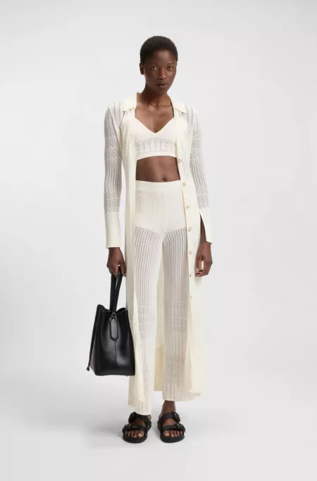 Knitted top in stretch fabric with mixed structures