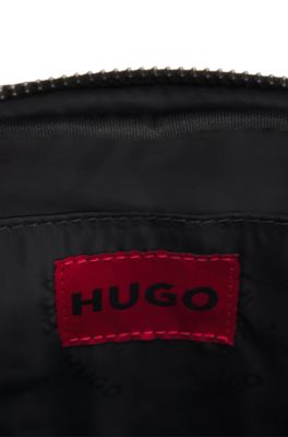 Reporter bag with branded adjustable strap and zip closure, Black