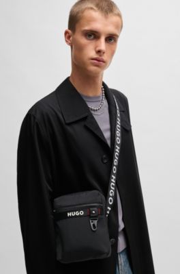 Reporter bag with branded adjustable strap and zip closure, Black