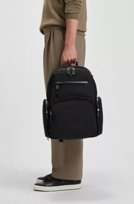 Multi-pocket backpack with leather trim