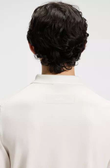 Knit polo sweater with covered placket