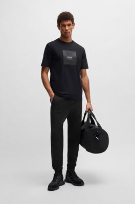Pantalones de ch&aacute;ndal en algod&oacute;n el&aacute;stico con parche de logo, Negro