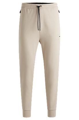 Stretch tracksuit bottoms with logo patch