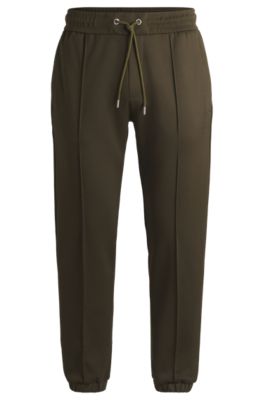 Pantalones de ch&aacute;ndal Porsche x BOSS con detalles de costuras, Verde oscuro