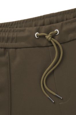 Pantalones de ch&aacute;ndal Porsche x BOSS con detalles de costuras, Verde oscuro