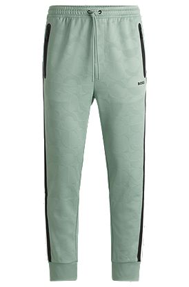 Relaxed-fit tracksuit bottoms with jacquard-woven circles