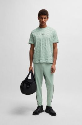 Pantalones de ch&aacute;ndal relaxed fit con c&iacute;rculos tejidos en jacquard, Cal