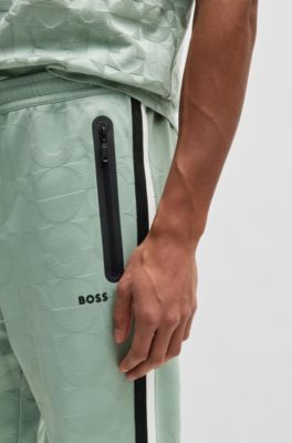 Pantalones de ch&aacute;ndal relaxed fit con c&iacute;rculos tejidos en jacquard, Cal