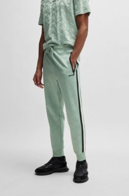 Relaxed-fit tracksuit bottoms with jacquard-woven circles