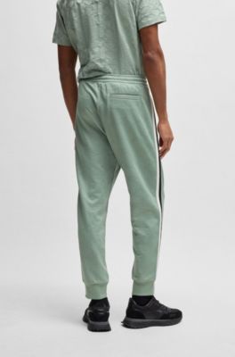 Pantalones de ch&aacute;ndal relaxed fit con c&iacute;rculos tejidos en jacquard, Cal