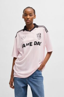 Football-inspired mesh T-shirt with Happy HUGO logo, light pink