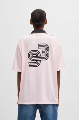 Football-inspired mesh T-shirt with Happy HUGO logo, light pink