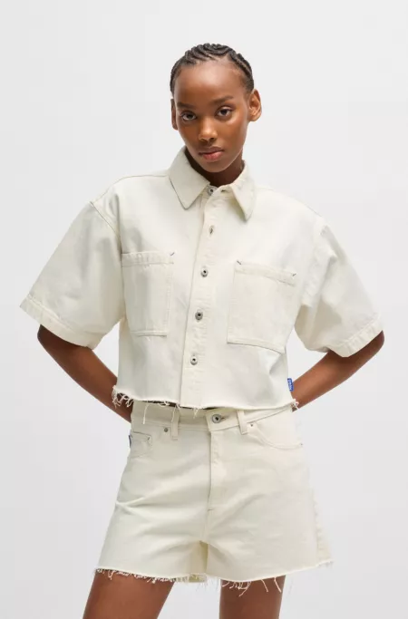 Cropped ecru-denim blouse with raw hem