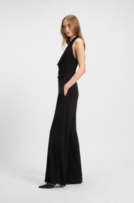 Mono de punto de crep&eacute; con cintur&oacute;n con logo en la hebilla, Negro