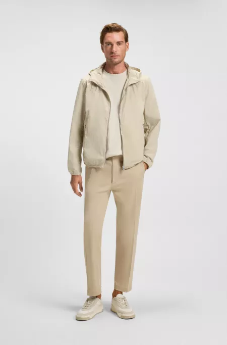 Water-repellent jacket in crinkle fabric with adjustable hood