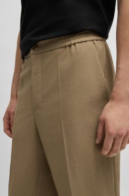 Pantalones slim fit en tejido jaspeado resistente a las arrugas, Marr&oacute;n