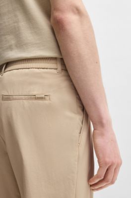 Pantalones slim fit en tejido de membrana el&aacute;stica ideal para viajar, Beige claro