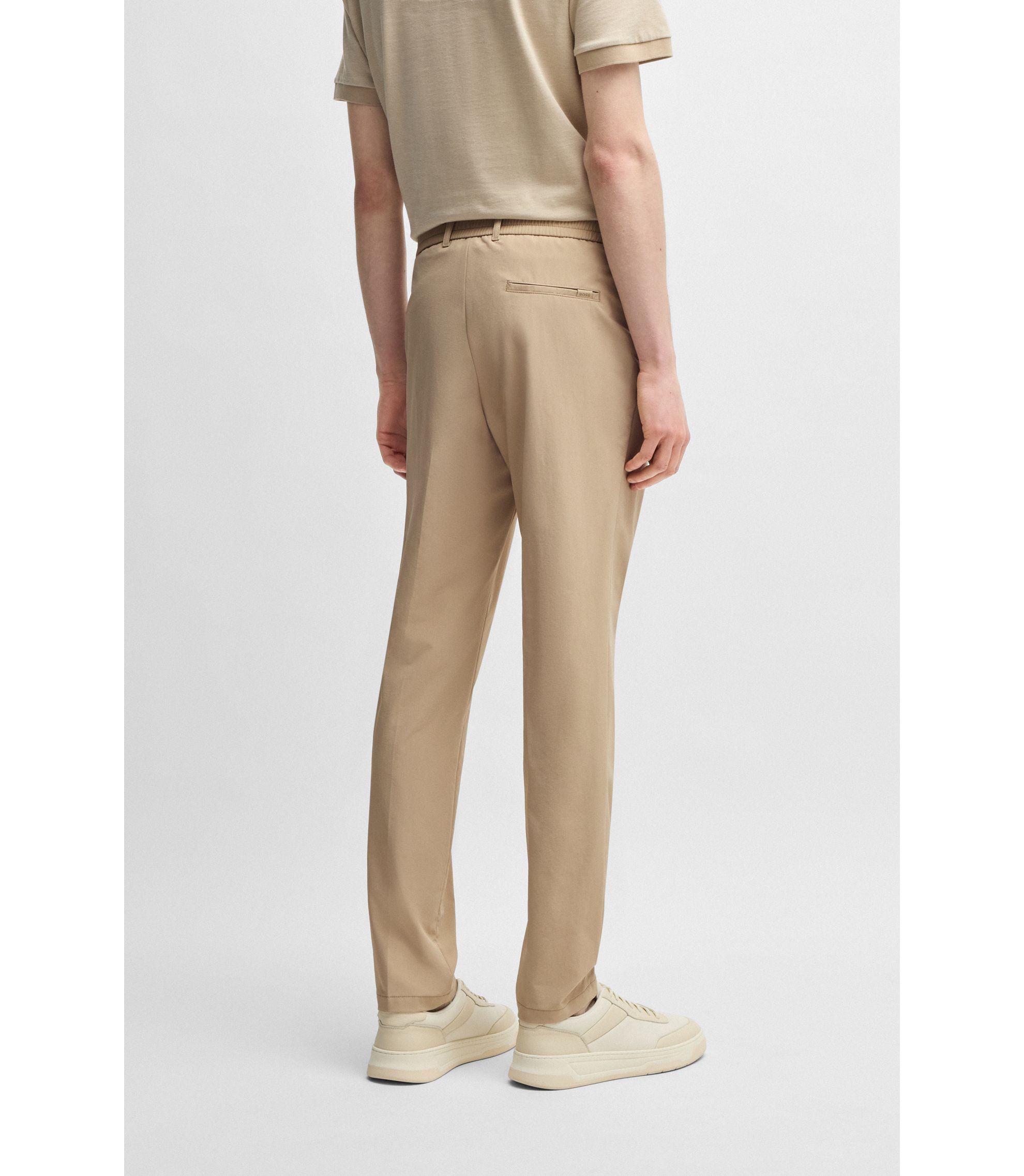 BOSS - Slim-fit trousers in travel-friendly stretch
