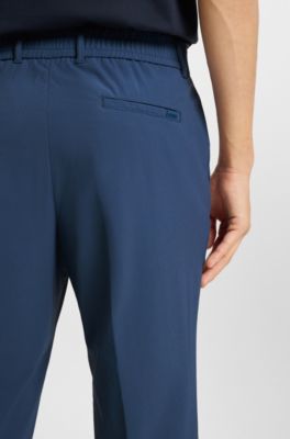 Slim-fit trousers in travel-friendly stretch softshell fabric, Blue