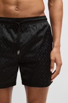 Swim shorts with all-over tonal monograms, Black