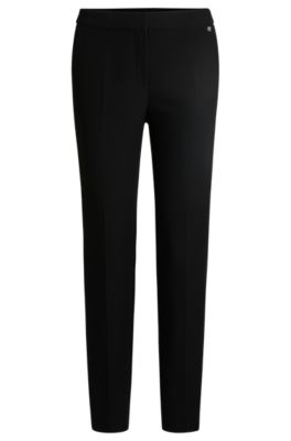 Pantalon Slim en tissu stretch avec rivet logot&eacute;, Noir