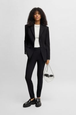 Pantalon Slim en tissu stretch avec rivet logot&eacute;, Noir