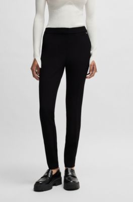Pantalon Slim en tissu stretch avec rivet logot&eacute;, Noir