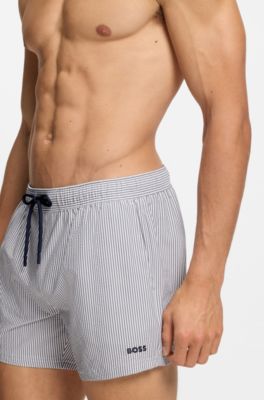 Embroidered-logo swim shorts in striped seersucker, Dark Blue