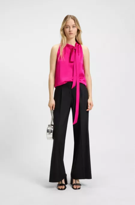 Sleeveless top in satin with tie neck