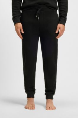 Pantalones de ch&aacute;ndal en mezcla de algod&oacute;n con estructura de rejilla, Negro