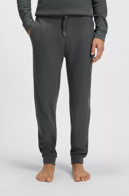 Waffle-structure tracksuit bottoms in a cotton blend