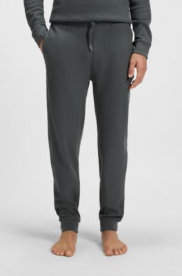 Pantalones de ch&aacute;ndal en mezcla de algod&oacute;n con estructura de rejilla, Cal
