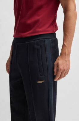 BOSS x ASTON MARTIN jersey tracksuit bottoms with perforated leather stripe, Dark Blue
