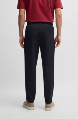 BOSS x ASTON MARTIN jersey tracksuit bottoms with perforated leather stripe, Dark Blue