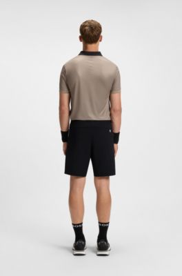 Short de tennis Actif en tissu stretch avec gestion de l&rsquo;humidit&eacute;, Noir
